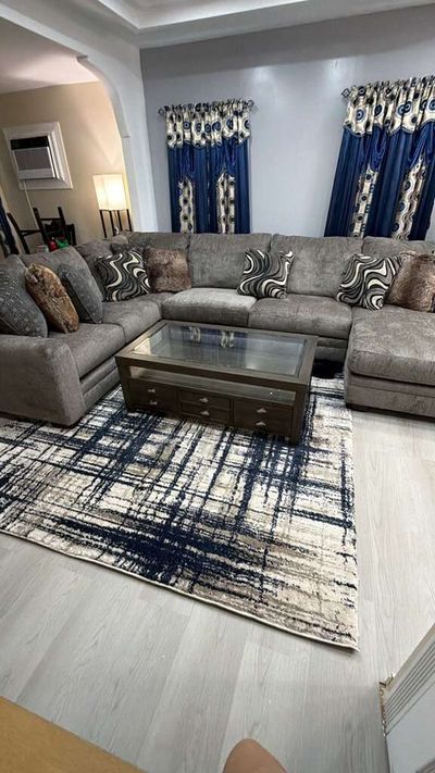 Living room with light gray wood-look plank flooring